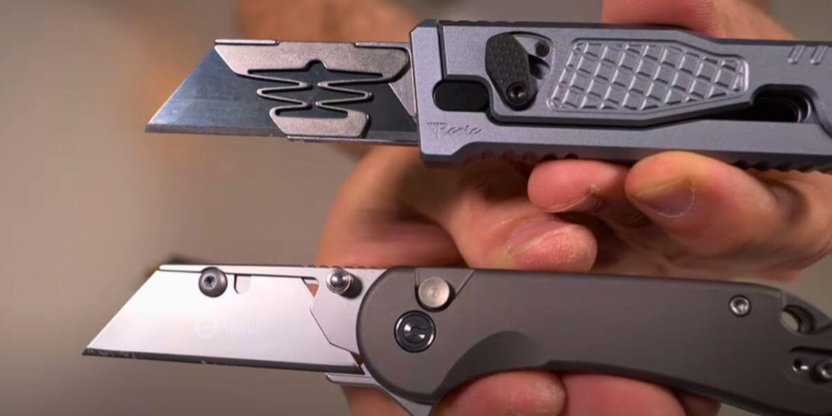 Close-up of two utility knives with different blade designs held by a person.