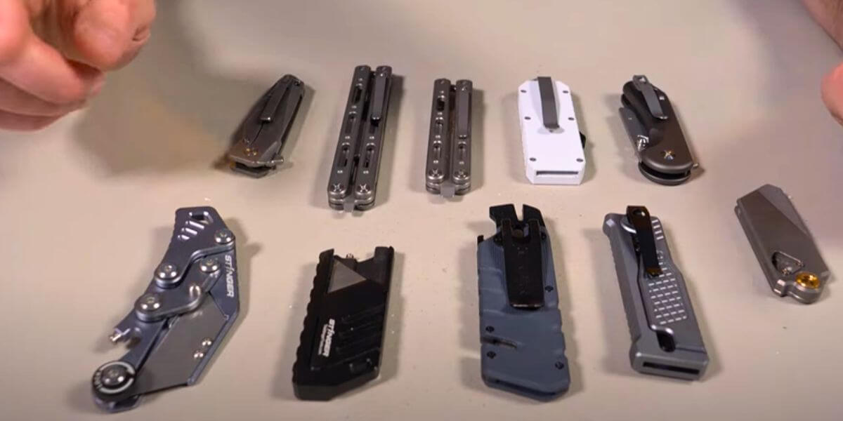 Various utility knives displayed on a surface with different designs and styles.