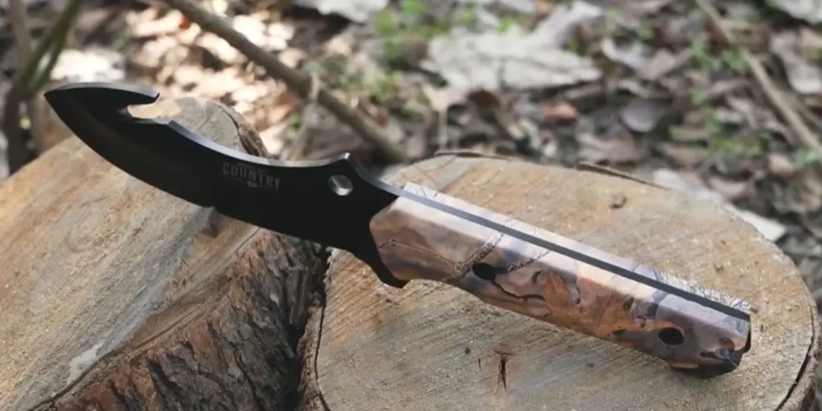 There is a weapon hook knife in the tree trunk.